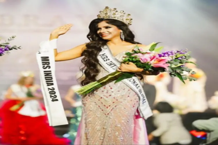 MP's Tani Gautam acknowledging applause after winning the title of 'Mrs International Global Beauty Pageant 2024'