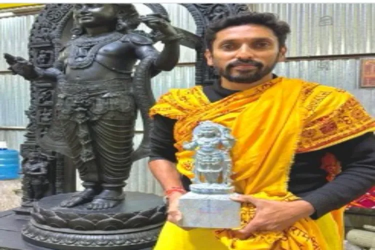 Noted sculptor Arun Yogiraj holding a miniature version of the Ram Lalla idol he has created