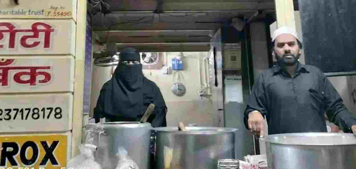 Aliya and Nasir Shaikh serving food