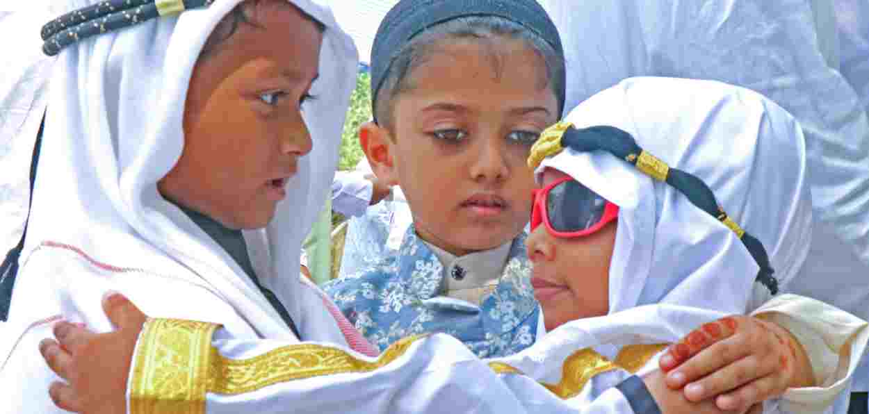  Children greet each other after offering namaz on the occasion of Eid-ul-Fitr, which marks the end of Ramadan, at Idgah Maidan, Bolpur, in Birbhum on Thursday.