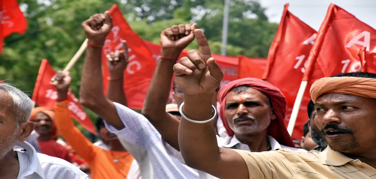 Workers taking out a march in Guwahati, Assam, on Labour day 