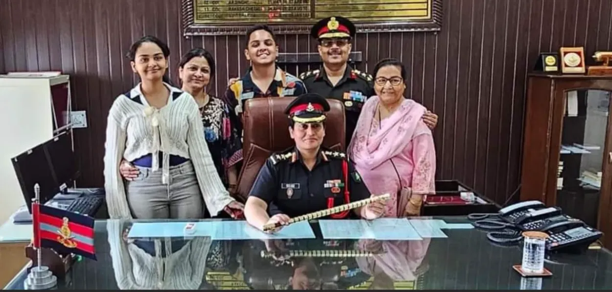 Col Ishrat with her family in her office (Facebook)