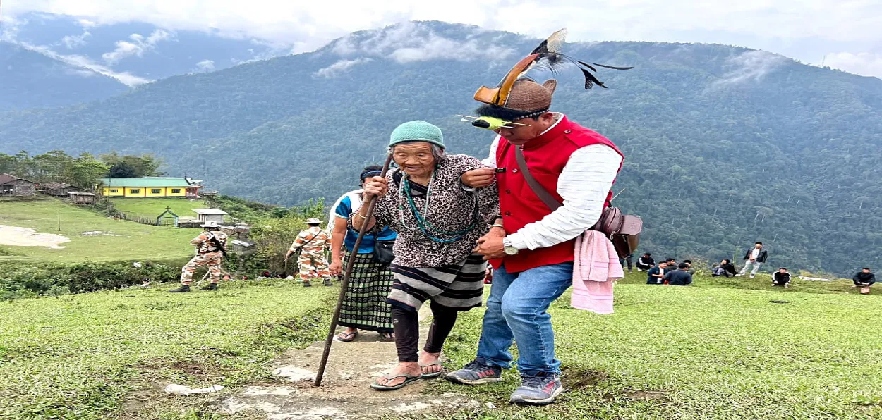 An elderly voters in Arunachal being helped to reach polling station