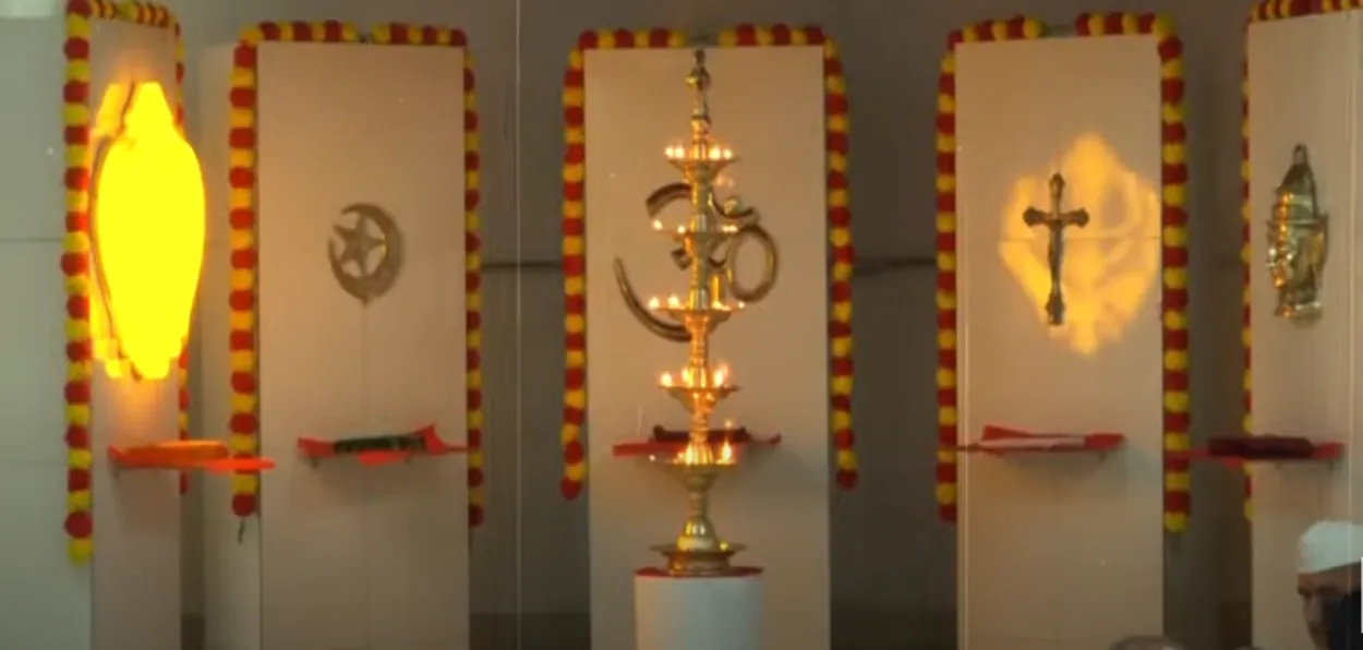 Alter of prayer room at Institute of National Integration with symbols of main religions of India
