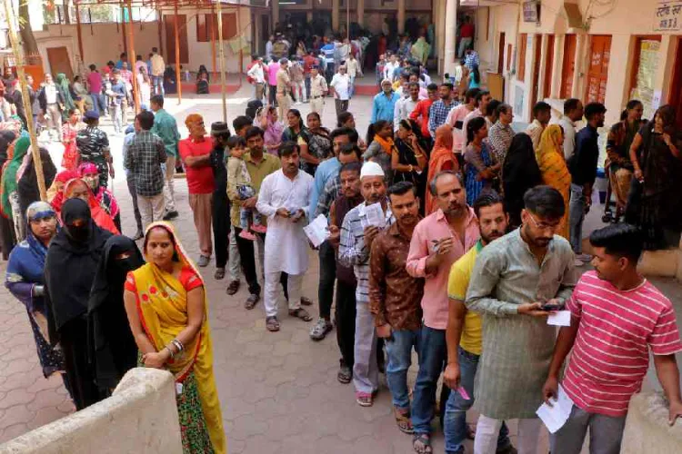 Voters are waiting in a queue to cast their votes