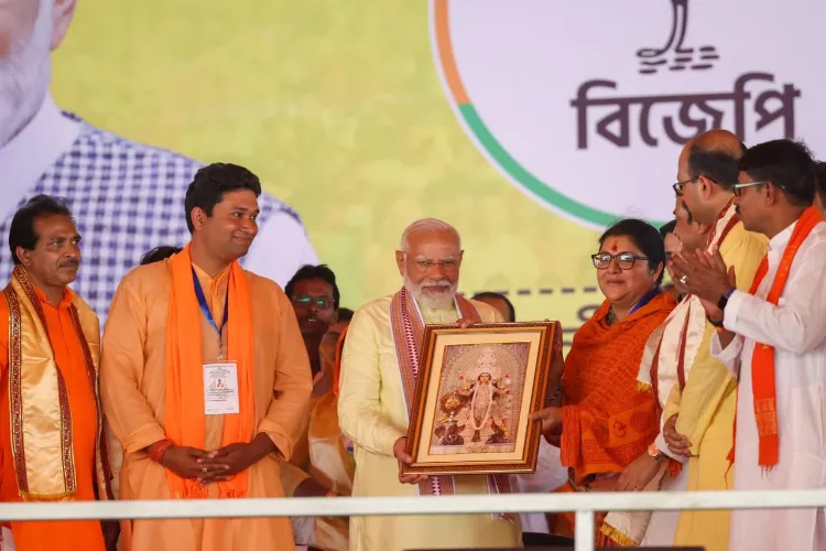 Prime Minister Narendra Modi being presented a painting of his mother Hira Ben