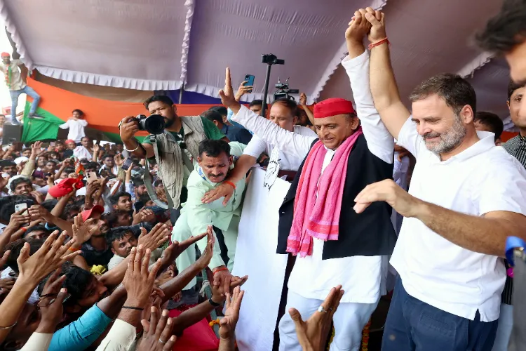 Congress leader Rahul Gandhi being greeted by the supporters during a joint public meeting with Samajwadi Party (SP) chief Akhilesh Yadav
