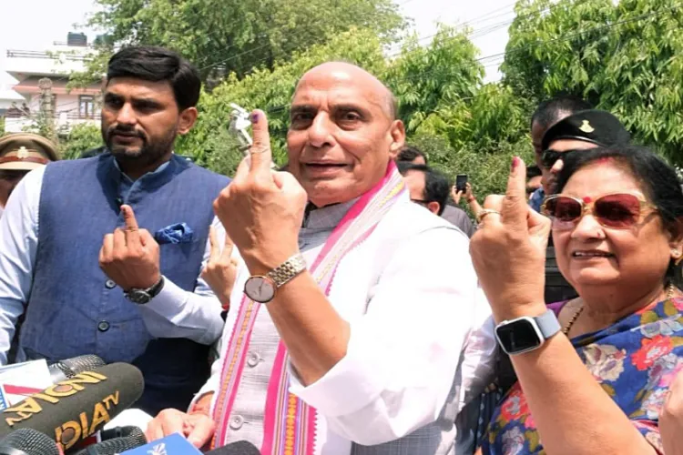 Union Minister Rajnath Singh nd his wife showing ink mark after casting his vote in Lucknow