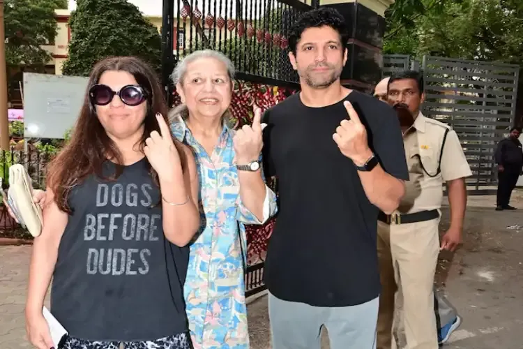 Farhan Akhtar, and Zoya Akhtar with their mother Honey Irani flaunting their inked finger after casting their vote in the Lok Sabha elections 