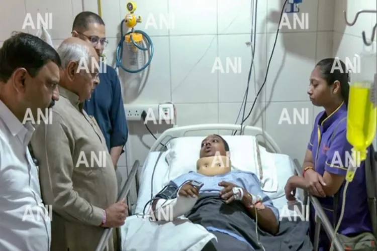 Gujarat minister meeting one of the injured persons in the Rajkot gaming zone fire in hospital