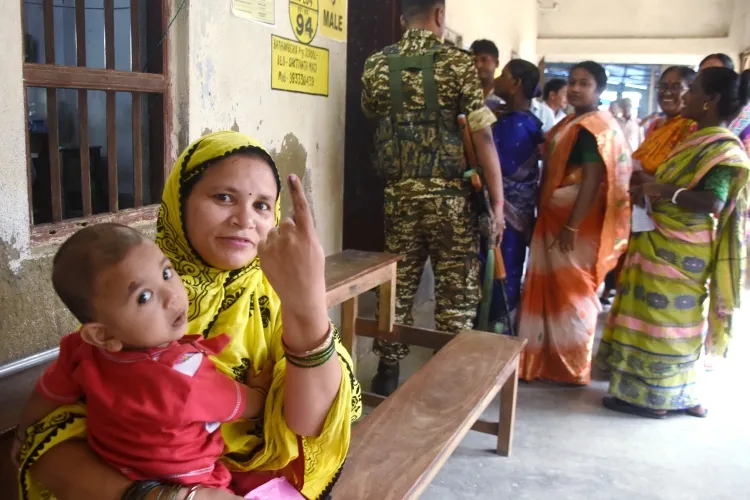 Woman voter show her finger mark in West Bengal {File)