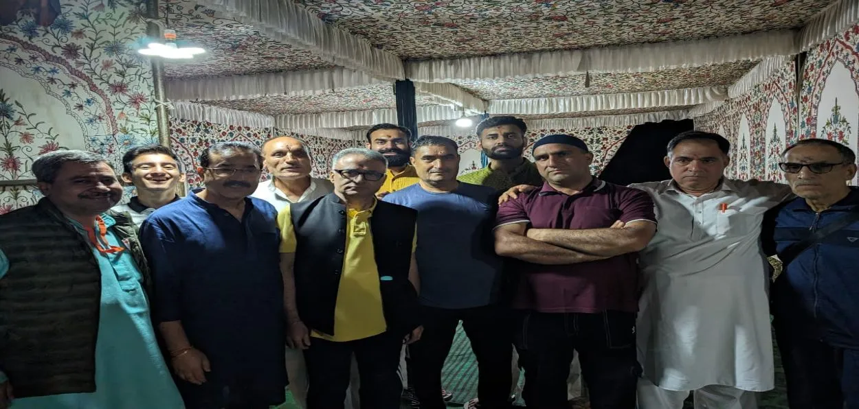 Hindus and Muslims in the temple premises Sanjay Pandita (second from left in Blue kurta) and Bilal (wearing skull cap)
