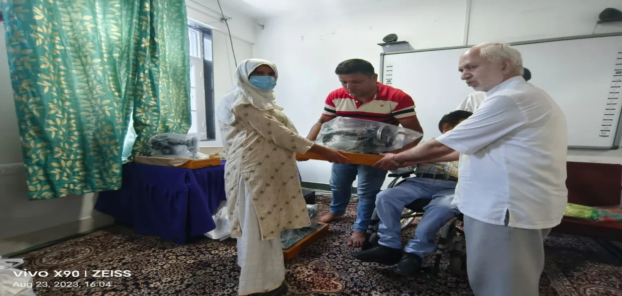 Abdul Rashid Hanjura, the founder of the IRRT, distributing ration kits for Eid