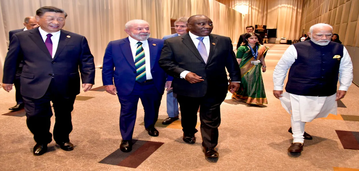 Prime Minister Narendra Modi arrives with South African President Cyril Ramaphosa, Chinese President Xi Jinping and Brazilian President Lula da Silva for the open plenary session of the 15th BRICS Summit