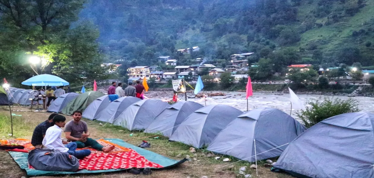 Tourists on the banks of the Kishanganga river