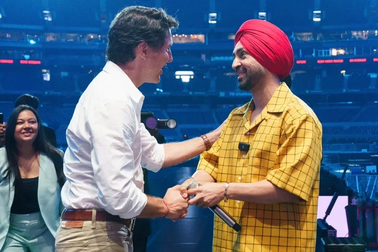 PM Justin Trudeau greets Diljit Dosanjh mid-performance in Toronto.
