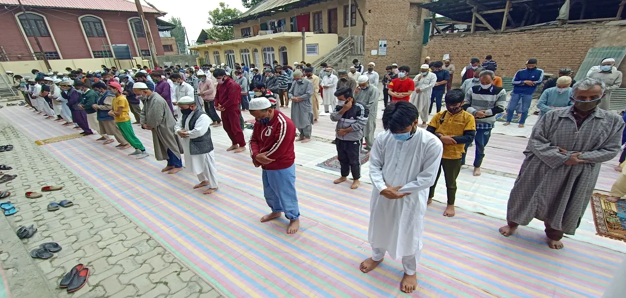 Muslim youth offering Namaz