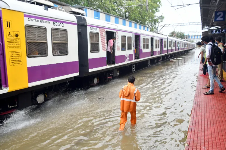 A trains stops on the waterlogged track in Mumbai 