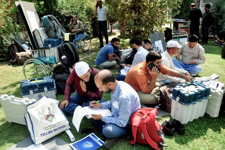 Polling officials on the eve of the second phase of J&K Assembly elections