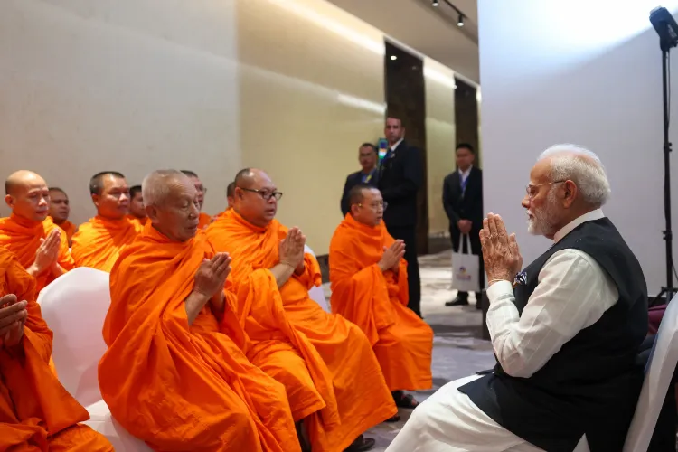 PM Modi meets respected monks and spiritual leaders in Lao PDR