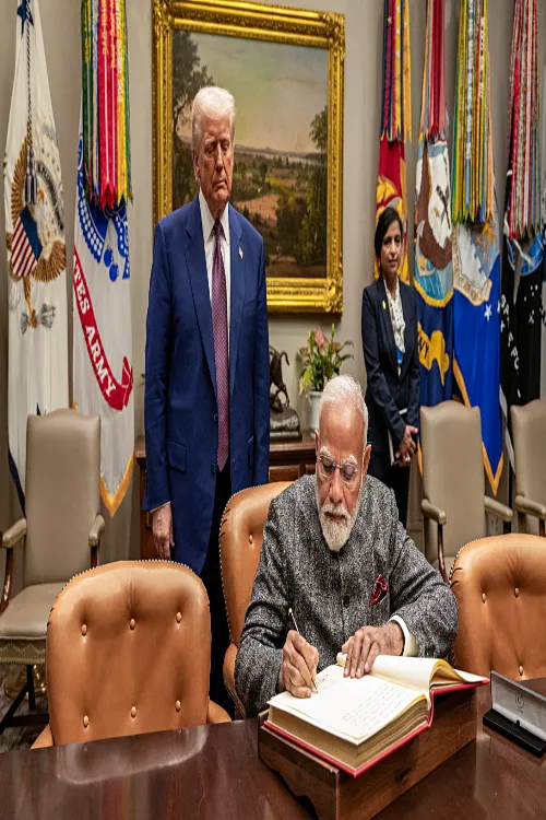 PM Modi signs the visitor's book in the presence of US President Trump at The White House in Washington, DC on Thursday. (ANI Photo)