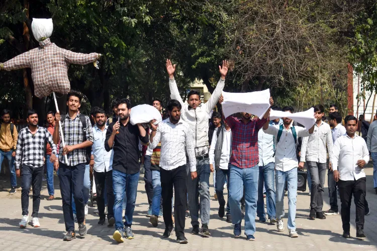 Students protest against the felling of trees at Meerut College by taking out a funeral procession of the college administration in Meerut on Monday, February 17, 2025.
