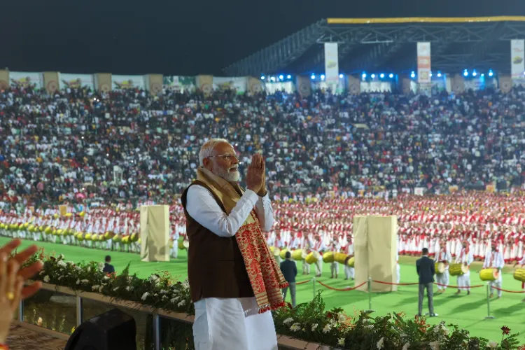 Prime Minister Narendra Modi greeting people at his civic reception in Guwahati