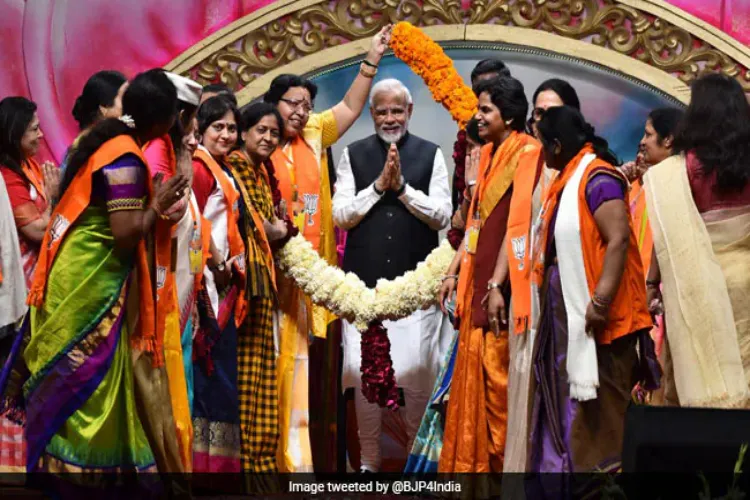 Prime Minister Narendra Modi with women at a function
