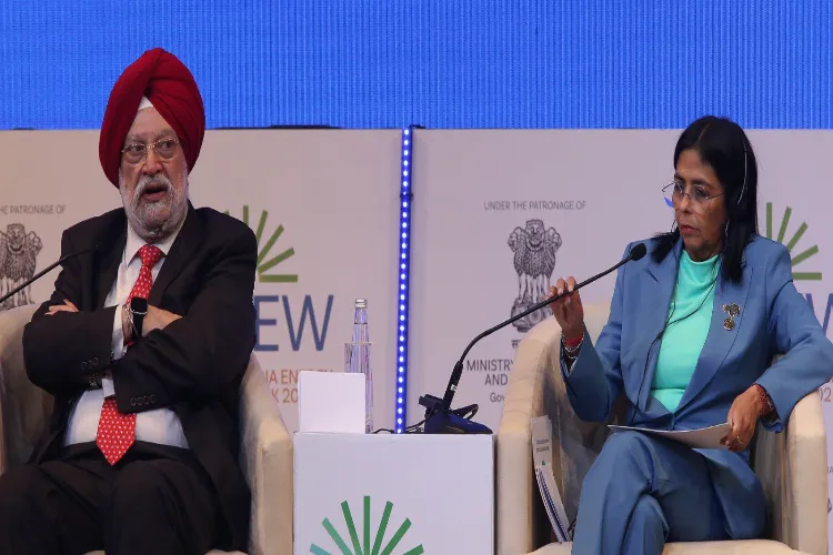 Petroleum Minister Hardeep Singh Puri, left, with Venezuela’s Vice President Delcy Rodriguez, who holds the petroleum portfolio