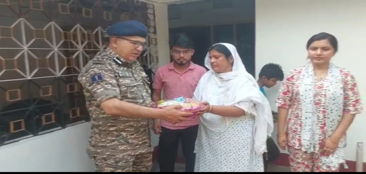 CRPF DIG Sunanda Kumar with the family of late Nasiruddin Sarkar