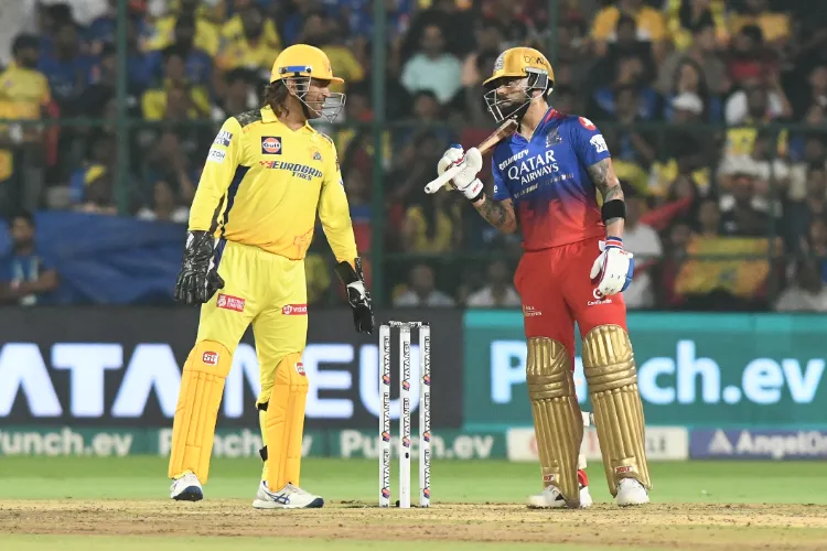Chennai Super Kings' MS Dhoni chats with Royal Challengers Bengaluru's Virat Kohli during the IPL match 