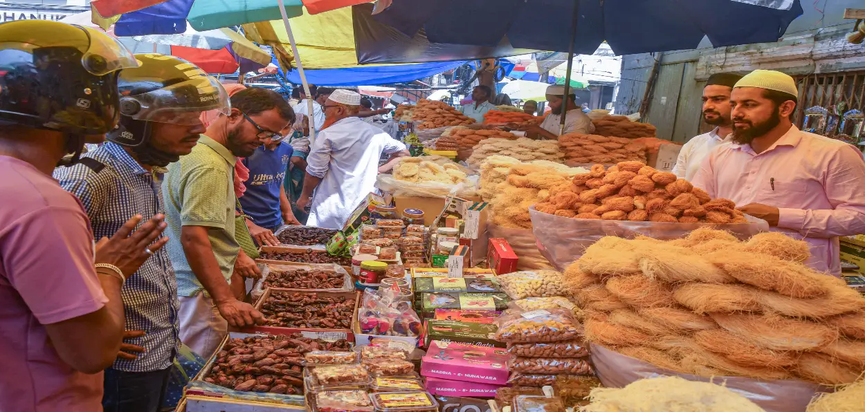  People shop Vermicelli (Sewaiyan) and dry fruits on the eve of the Eid al-Fitr, in Guwahati on Sunday.