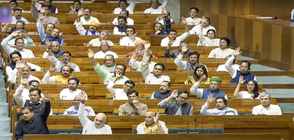 Members of Lok Sabha raising hand in favour of the Waqf Amendment Bill 2025 