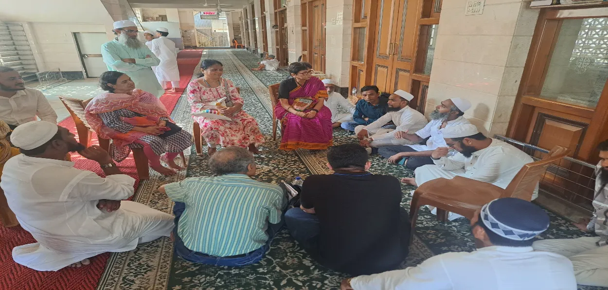 Medha Kulkarni (wearing sari) and her companions inside Noorani Masjid