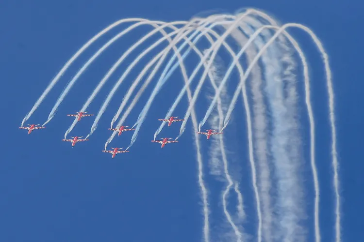  The Indian Air Force's (IAF) Surya Kiran Aerobatic Team flies through the skies during an aerial show in Mumbai on January 14, 2024 (File photo)