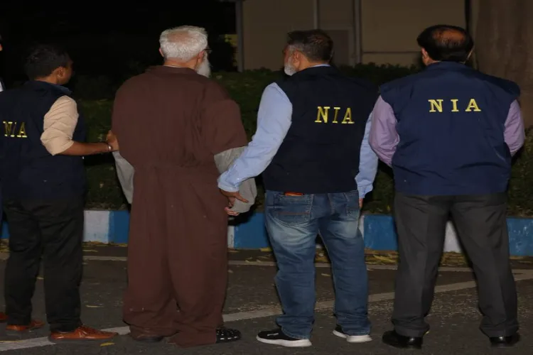 Tahawwur Hussain Rana, one of the key conspirator of the 2008 Mumbai attacks, with NIA officials