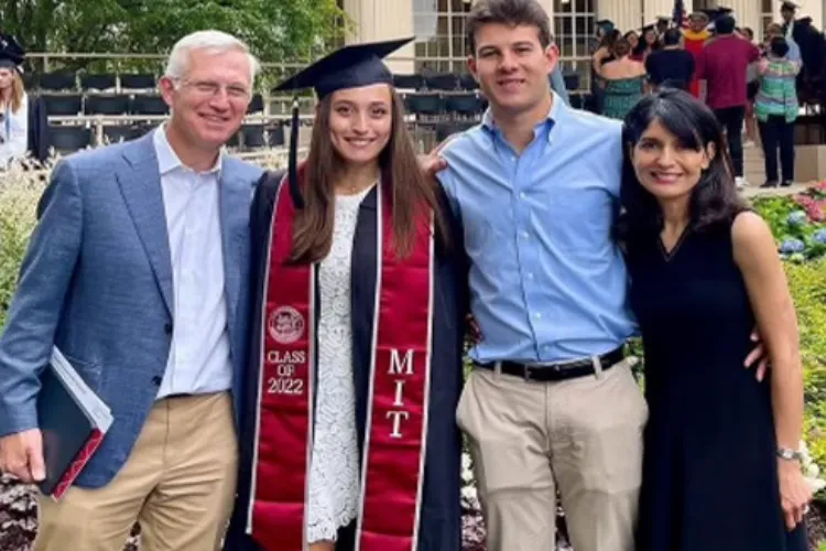 Joy Saini, right, and her husband Michael Groff, flank their daughter Kareena Groff and her partner James Santoro, in the family photo. 