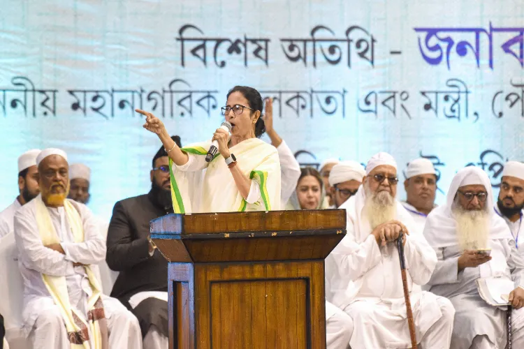 West Bengal Chief Minister Mamata Banerjee speaks during a meeting with Muslim religious leaders to discuss the Waqf (Amendment) Act 2025, at Netaji Indoor Stadium in Kolkata on Wednesday.