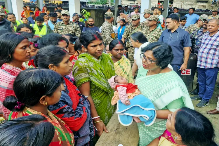 National Commission for Women (NCW) Chairperson Vijaya Rahatkar meets the families affected by the Murshidabad violence at a shelter home, in Malda on Friday. 