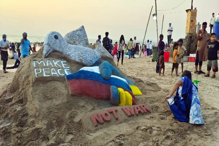 A Sand artist creates a sand sculpture depicting the message 'Make Peace Not War' regarding the war between Russia and Ukraine in Mumbai. (Photo for representation) 