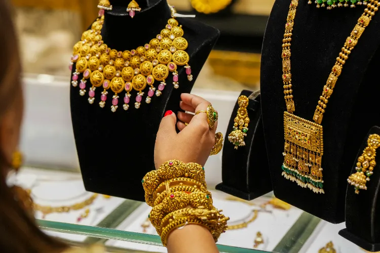 Gold ornaments on display at a jewellery showroom.