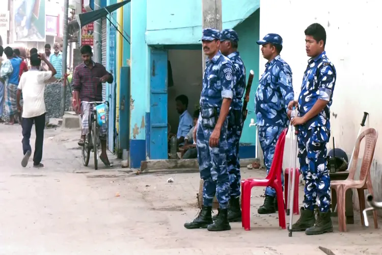 RAF personnel stand guard at Dhuliyan where violence broke out on April 11 during a protest against the Centre's Waqf (Amendment) Act in Murshidabad.