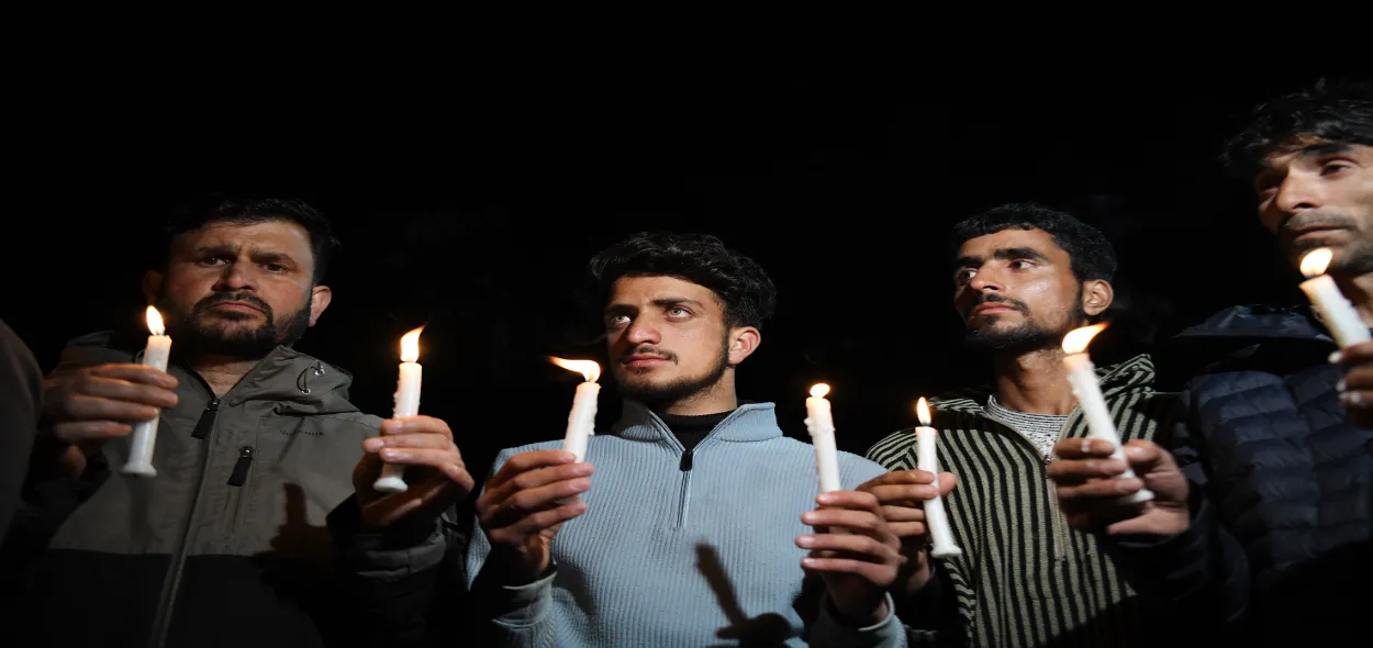People take part in a candlelight protest condeming Pahalgam terror attack, in Pahalgam on Tuesday.
