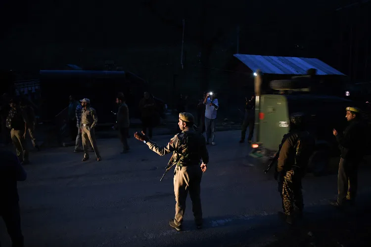 Security personnel stand guard at a check post in J&K's Pahalgam after terrorists targeted tourists, on Tuesday.
