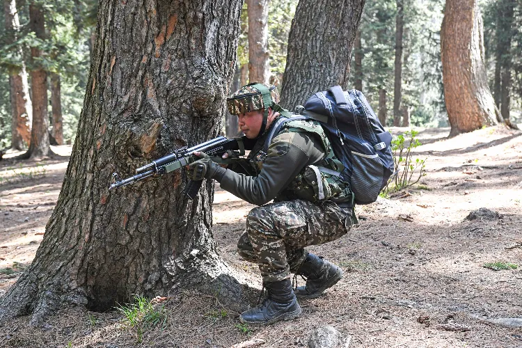 Security personnel carry out a search operation at Baisaran area following the Pahalgam terrorist attack, in Pahalgam on Wednesday.