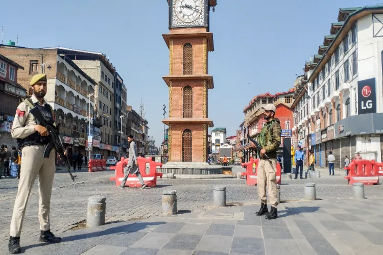 Jammu and Kashmir police personnel stand guard at Clock Tower, Lal Chowk amid bandh calls over Pahalgam terror attack in Srinagar on Wednesday.