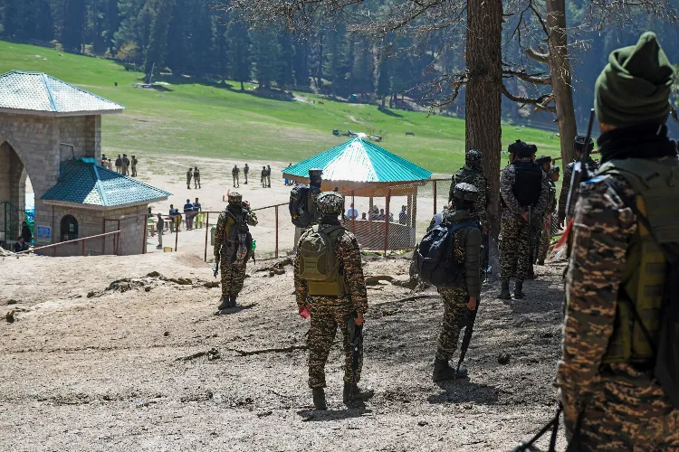 Security personnel carry out a search operation.