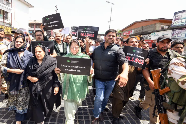 Former Jammu and Kashmir Chief Minister and People's Democratic Party (PDP) Chief Mehbooba Mufti along with party leaders and supporters protest against the Pahalgam terror attack, in Srinagar on Wednesday.