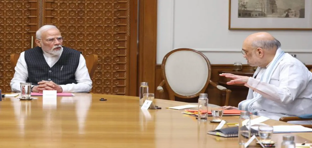Home Minister Amir Shah making a point to Prime Minister Narendra Modi during the meeting of the Cabinet Committee on Security (CCS), in New Delhi