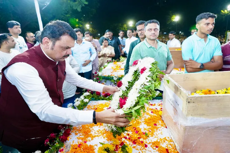Maharashtra Chief Minister Devendra Fadnavis pays tribute to the mortal remains of Atul Mone, Sanjay Lele, and Hemant Joshi, who lost their lives in the Pahalgam terror attack, at Dombivali in Thane on Wednesday.